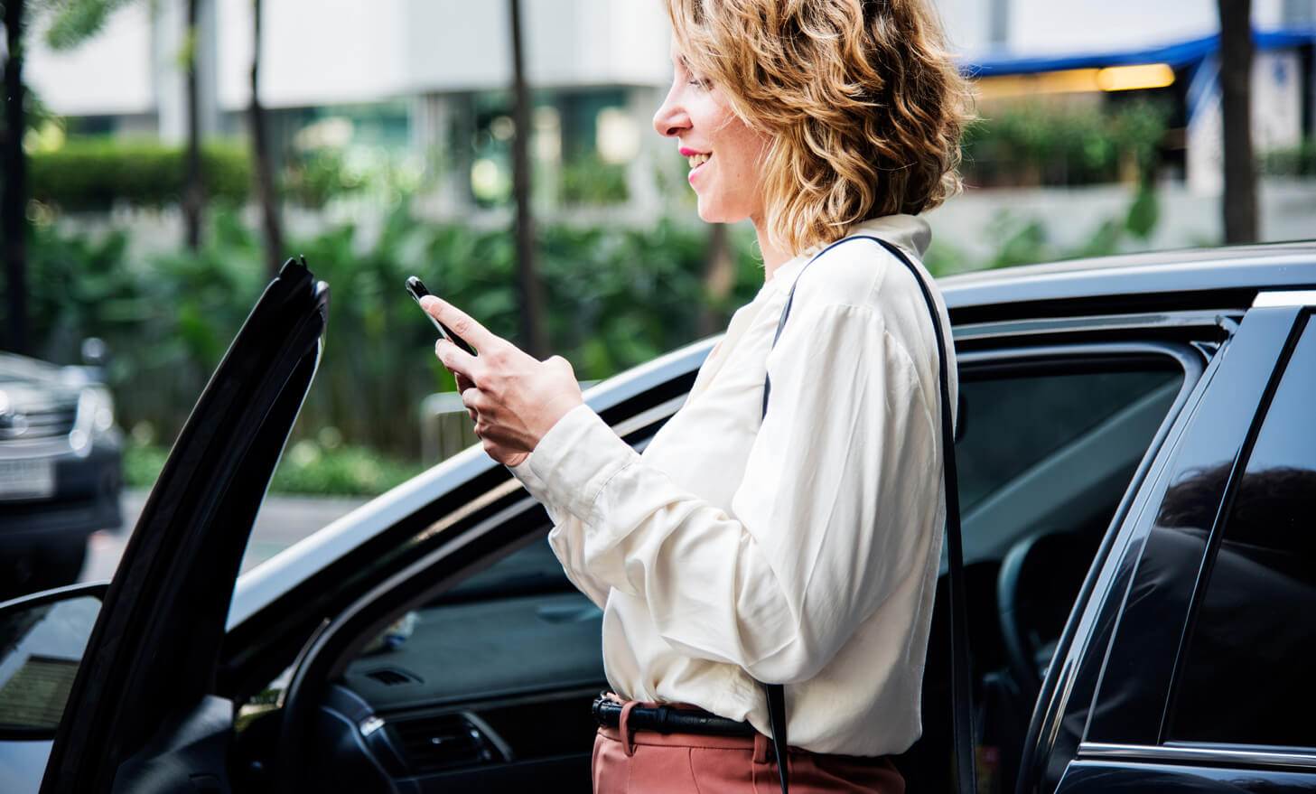 Woman accessing government fleet vehicle with mobile app